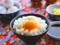 On raw egg with rice